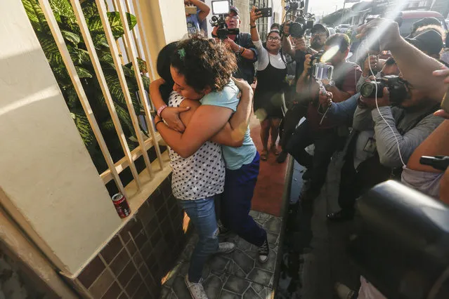 Opposition member María Adilia Peralta Cerratos is embraced by a relative as she returns home after being in prison, in Masaya, Nicaragua, Monday, May 20, 2019. Peralta Cerratos is one of 100 prisoners the Nicaraguan government released Monday in a form of house arrest, including three human rights activists. (Photo by Alfredo Zuniga/AP Photo)