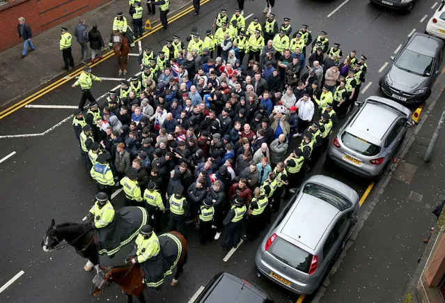 Police contain Rangers fans while they make their way to the stadium prior to the Ladbrokes Scottish Premiership match between Celtic and Rangers at Celtic Park on March 12, 2017 in Glasgow, Scotland. (Photo by Jane Barlow/PA Wire)