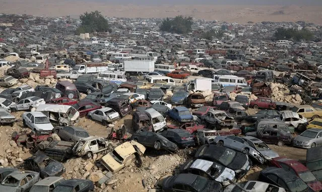 Used cars at a junkyard in Helwan, Cairo, 23 November 2021. An increasing number of vehicles are being either scrapped or recycled in Egypt. In an attempt to lower pollution and improve livelihoods, the Egyptian government will grant licenses to new vehicles only if they can operate on a bi-fuel system, a move that will also grant economic gains for the gas-rich country. (Photo by Khaled Elfiqi/EPA/EFE)
