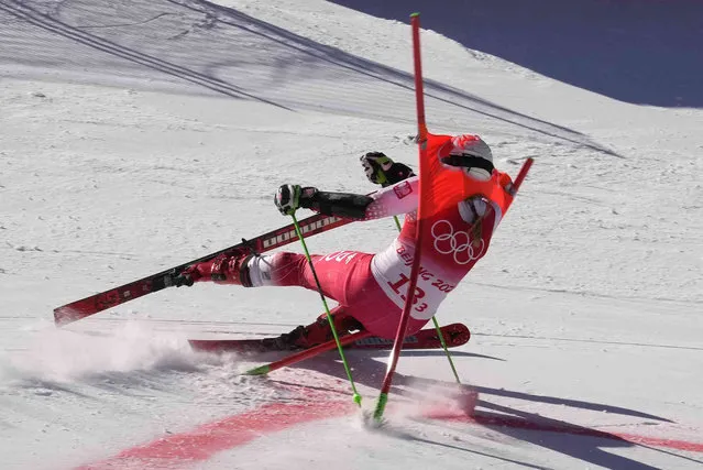 Magdalena Luczak of Poland crashes during the mixed team parallel skiing event at the 2022 Winter Olympics, Sunday, February 20, 2022, in the Yanqing district of Beijing. (Photo by Luca Bruno/AP Photo)