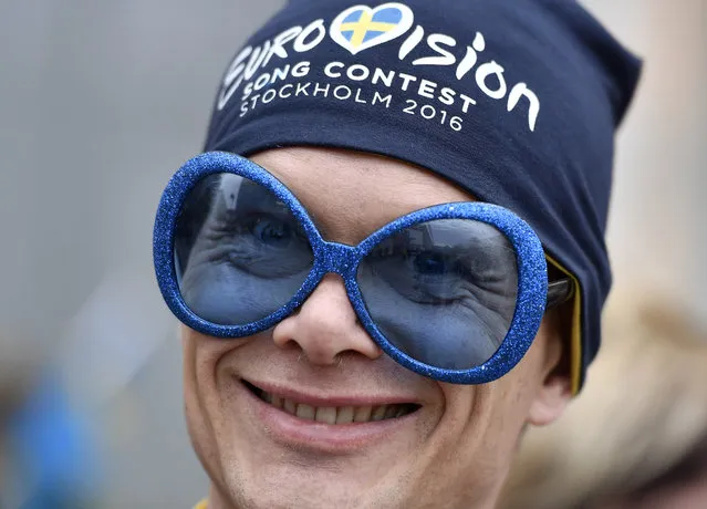 A fan smiles in front of the Globen Arena prior the first the Eurovision Song Contest final in Stockholm, Sweden, Saturday, May 14, 2016. (Photo by Martin Meissner/AP Photo)