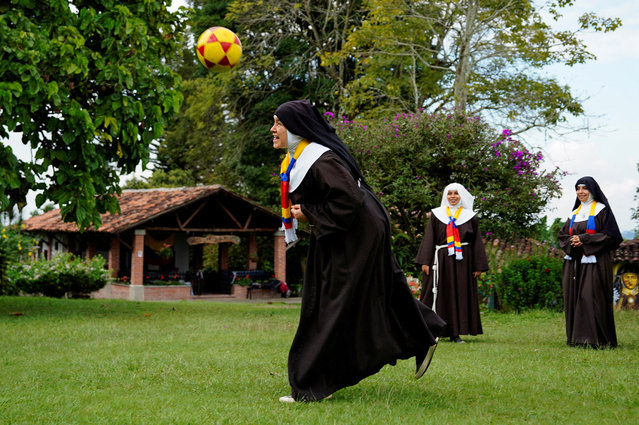 Poor Clare Sisters play soccer as they support the Colombian national team in the Copa America final against Argentina, at a convent in Montenegro, Colombia  on July 13, 2024. (Photo by Vladimir Encina/Reuters)