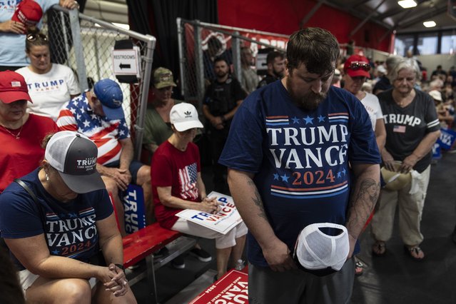 Supporters of Republican vice presidential candidate Sen. JD Vance, R-Ohio, pray during a campaign event in Glendale, Ariz., Wednesday, July 31, 2024. (Photo by Jae C. Hong/AP Photo)