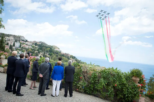 G7 leaders watch an Italian flying squadron as part of activities at the G7 summit in Taormina, Sicily Italy, May 26, 2017. (Photo by Guido Bergmann/Reuters/Courtesy of Bundesregierung)