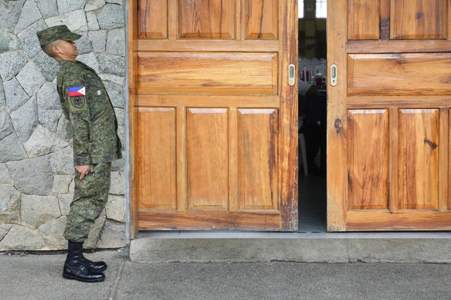 A cadet of the Philippine Military Academy stands at attention outside a hall at Fort Gregorio Del Pilar in Baguio, northern Philippines on Thursday, August 29, 2024. (Photo by Aaron Favila/AP Photo)