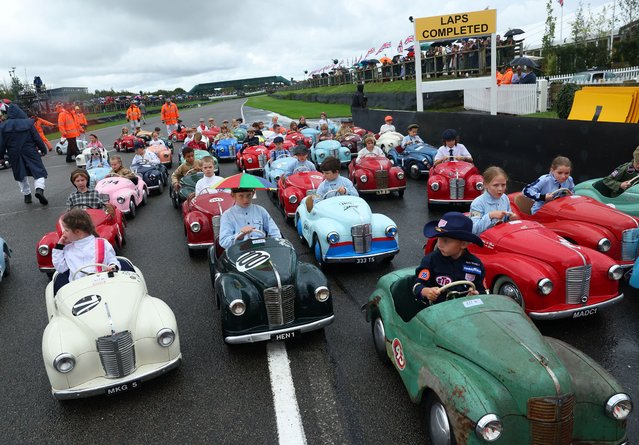 Children take part in the Settrington Cup Pedal Car Race as motoring enthusiasts attend the Goodwood Revival, a three-day historic car racing festival in Goodwood, near Chichester, southern Britain on September 8, 2024. (Photo by Toby Melville/Reuters)