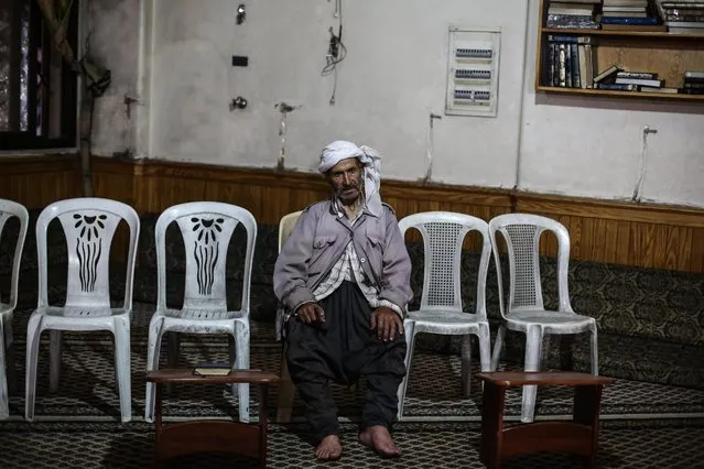 A Syrian man is seen at a mosque during night prayers, Tarawih, in rebel-held town of Douma, Damascus, Syria, 15 June 2016. Muslims around the world celebrate the holy month of Ramadan by praying during the night time and abstaining from eating and drinking during the period between sunrise and sunset. Ramadan is the ninth month in the Islamic calendar and it is believed that the Koran's first verse was revealed during its last 10 nights. (Photo by Mohammed Badra/EPA)