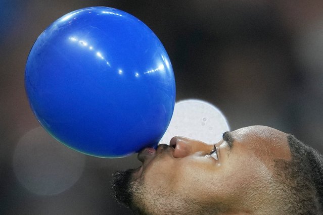 Chelsea's Christopher Nkunku celebrates after scoring his side's third goal during the Europa Conference League opening phase soccer match between Chelsea and Gent at Stamford Bridge in London, Thursday, October 3, 2024. (Photo by Kin Cheung/AP Photo)