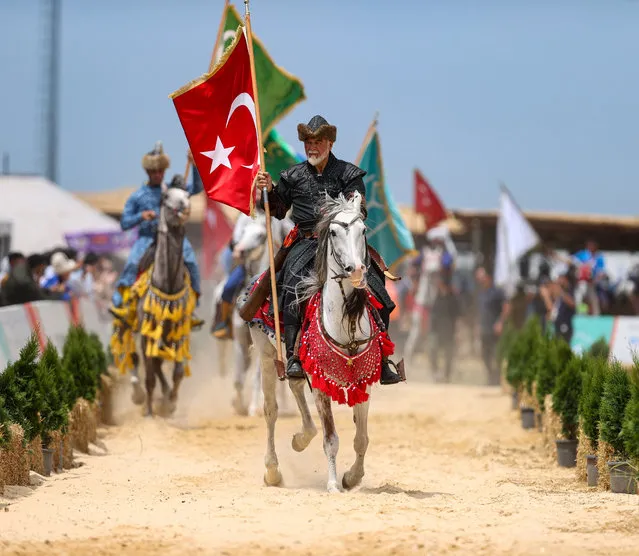 Kokboru, traditional horse game, team perform at the opening ceremony of the 5th Etnospor Culture Festival held at Ataturk Airport, in Istanbul, Turkiye on June 09, 2022. (Photo by Ali Atmaca/Anadolu Agency via Getty Images)