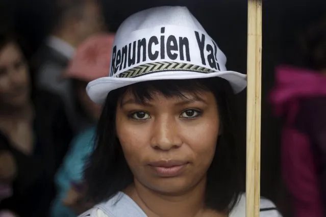 A demonstrator poses for a picture during a protest to demand the resignation of Guatemala's President Otto Perez Molina in Guatemala City, August 15, 2015. (Photo by Josue Decavele/Reuters)