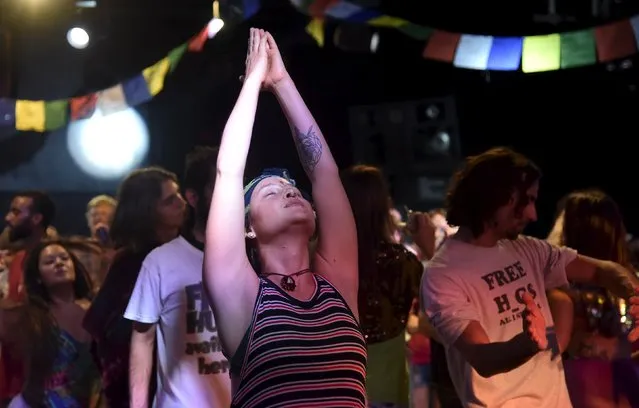 Club-goers dance at “Morning Gloryville” at the Ministry of Sound in south London August 11, 2015. (Photo by Toby Melville/Reuters)