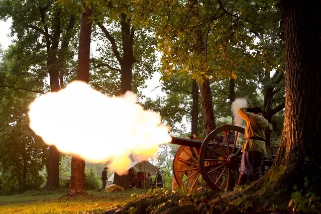 Civil War re-enactors fire a cannon every hour to commemorate the 150th anniversary of the Battle of Atlanta, in Atlanta, Georgia, July 19, 2014. (Photo by Christopher Aluka Berry/Reuters)