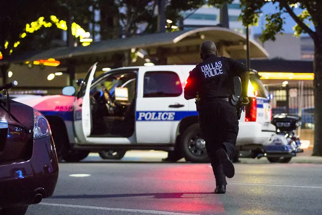 Dallas Police respond after shots were fired at a Black Lives Matter rally in downtown Dallas on Thursday, July 7, 2016. Dallas protestors rallied in the aftermath of the killing of Alton Sterling by police officers in Baton Rouge, La. and Philando Castile, who was killed by police less than 48 hours later in Minnesota. (Photo by Smiley N. Pool/The Dallas Morning News)
