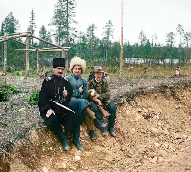 Photos by Sergey Prokudin-Gorsky. Group (Sergeĭ Mikhaĭlovich Prokudin-Gorskiĭ and two men in Cossak dress (?) seated on the ground). Russia, Arkhangelsk province, Kem' uyezd (district), Nadvoitsy village and outskirts, 1916