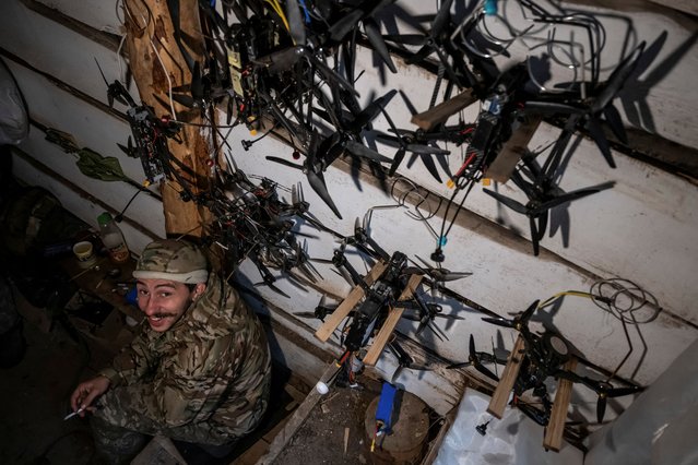 A serviceman, who operates first-person view (FPV) drones, of Da Vinci Wolves Separate Mechanized Battalion, named after Dmytro Kotsiubailo, of the 59th mechanized brigade of the Ukrainian Armed Forces, poses for a picture at his position in a front line, amid Russia's attack on Ukraine, near the town of Pokrovsk in Donetsk region, Ukraine on October 20, 2024. (Photo by Viacheslav Ratynskyi/Reuters)