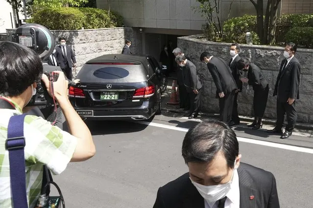 A hearse which is believed to carry the body of former Prime Minister Shinzo Abe, arrives at his home Saturday, July 9, 2022, in Tokyo. (Photo by Eugene Hoshiko/AP Photo)