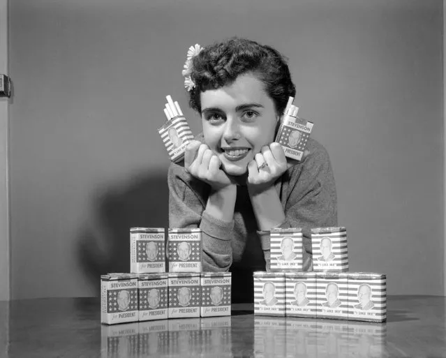 Nancy Adams, 20, of Beuchel, Kentucky, holds brands of cigarettes named “I Like Ike” and “Stevenson For President”, novelty blends manufactured by Tobacco Blending Corporation, August 9, 1952 in Louisville, Kentucky. By comparing sales volume of each brand the company hopes to weed out the most popular candidate for president. (Photo by H.B. Littell/AP Photo)