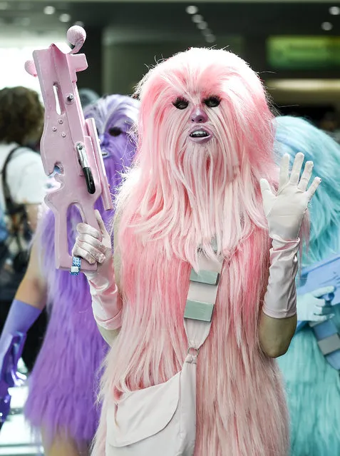 Ashley Bailey, dressed as one of "Chewie's Angels," waves to fans  on day two of Comic-Con International held at the San Diego Convention Center Friday, July 22, 2016, in San Diego.  (Photo by Denis Poroy/Invision/AP Photo)