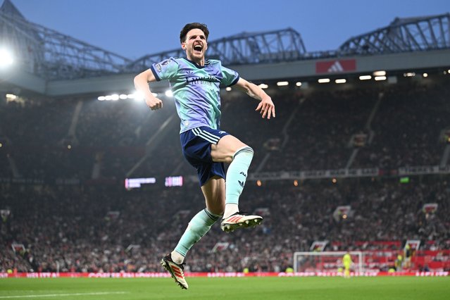Declan Rice of Arsenal celebrates scoring his team's first goal during the Premier League match between Manchester United FC and Arsenal FC at Old Trafford on March 09, 2025 in Manchester, England. (Photo by Stuart MacFarlane/Arsenal FC via Getty Images)