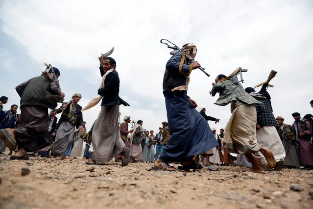 Tribesmen loyal to the Houthi movement perform the traditional Baraa dance as they attend a tribal gathering to show support to a political council formed by the movement and the General People's Congress party to unilaterally rule Yemen by both groups in Sanaa, August 14, 2016. (Photo by Khaled Abdullah/Reuters)