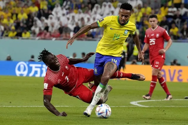 Switzerland's Breel Embolo, left, and Brazil's Eder Militao vie for the ball during the World Cup group G soccer match between Brazil and Switzerland, at the Stadium 974 in Doha, Qatar, Monday, November 28, 2022. (Photo by Natacha Pisarenko/AP Photo)