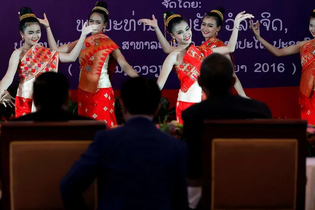 Laos President Bounnhang Vorachith (seated, L) and U.S. President Barack Obama (seated, R) watch a dance performance at a luncheon following their bilateral meeting, on the sidelines of the ASEAN Summit, at the Presidential Palace in Vientiane, Laos September 6, 2016. (Photo by Jonathan Ernst/Reuters)