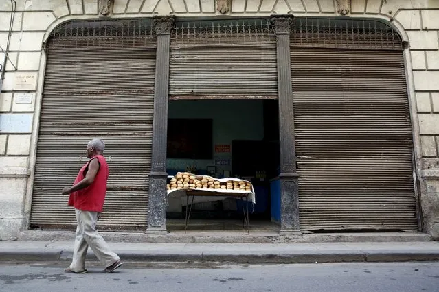 A man walks past a subsidised state store, or “bodega”, where Cubans can buy basic products with a ration book they receive annually from the government in Havana September 18, 2015. (Photo by Carlos Garcia Rawlins/Reuters)