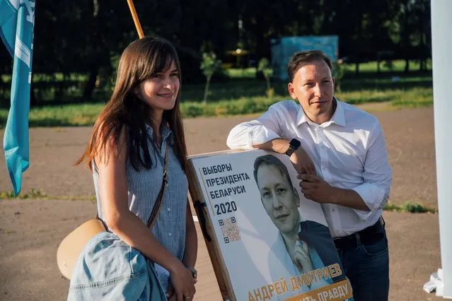Alternative candidate Andrei Dmitriev (R) of the Tell the Truth social movement poses with a supporter as he campaigns ahead of the Belarusian presidential elections on July 18, 2020 in Minsk, Belarus. Next month’s presidential elections in Belarus are scheduled for August 9. (Photo by Tanya Kapitonova/Getty Images)
