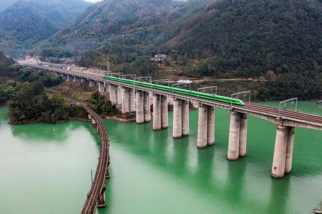 The first Fuxing high-speed train runs along the new Chengdu-Kunming High-speed Railway on December 26, 2022 in Leshan, Sichuan Province of China. With a length of 915 km and a designed speed of 160 km per hour, a new high-speed railway linking Chengdu and Kunming fully opened on Monday, cutting the travel time from 19 hours to 7.5 hours. (Photo by VCG/VCG via Getty Images)