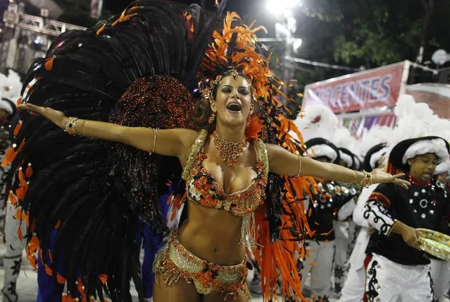 Drum Queen Lucilene Caetano of the Inocentes de Belford Roxo samba school dances on the first night of the annual carnival parade in Rio de Janeiro's Sambadrome, February 10, 2013. (Photo by Pilar Olivares/Reuters)