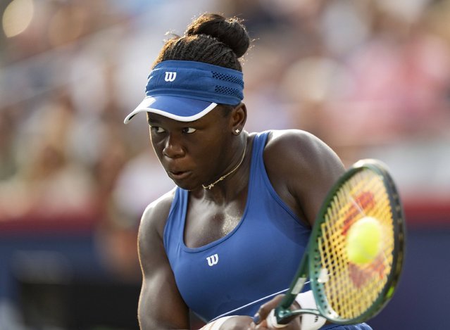 Victoria Mboko, of Canada, hits a return to Naomi Osaka, of Japan, during finals action at the National Bank Open women's tennis tournament in Montreal, Thursday, August 7, 2025. (Photo by Christinne Muschi/The Canadian Press via AP Photo)