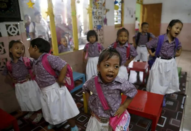 Kindergarten students sing a song inside a classroom at Penjaringan district in Jakarta October 6, 2015. (Photo by Reuters/Beawiharta)
