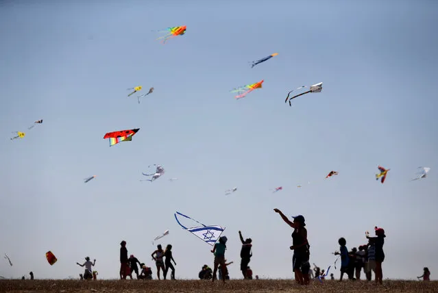Israelis fly kites during Rosh Hashanah holiday, the first two days of the Jewish new year, in Beit Guvrin National Park near the city of Kiryat Gat, October 4, 2016. (Photo by Amir Cohen/Reuters)