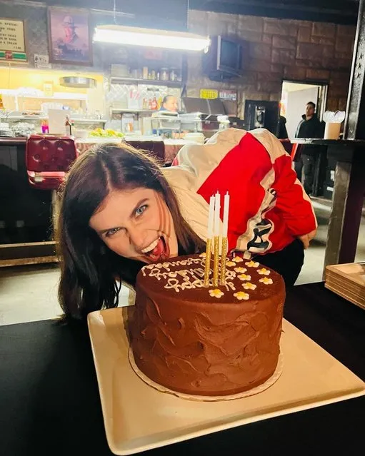 American actress Alexandra Daddario gets ready to chow down on a birthday cake on March 16, 2023. (Photo by alexandradaddario/Instagram)
