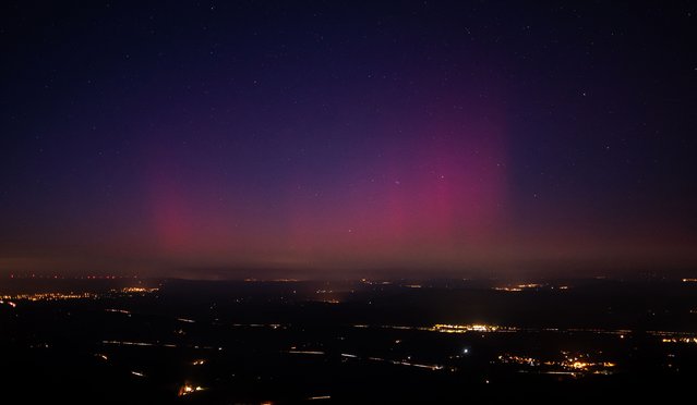 This picture taken from the southeastern France village of La Roquebrussanne shows an aurora borealis early on January 1, 2025. (Photo by Yohan Laurito/AFP Phoot)