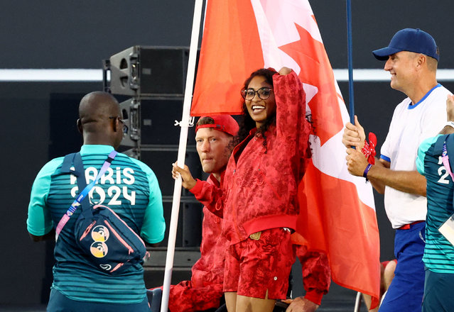 Flagbearers Patrick Anderson of Canada and Katarina Roxon of Canada lead their contingent during the Paris 2024 Paralympic Games Opening Ceremony in Paris on August 28, 2024. (Photo by Eng Chin An/Reuters)