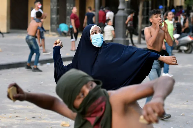 People gather to protest near the parliament, one week after the major explosion at Beirut's harbour, Beirut, Lebanon, 11 August 2020. Lebanese Health Ministry said at least 171 people were killed, and more than 6000 injured in the Beirut blast that devastated the port area on 04 August and believed to have been caused by an estimated 2,750 tons of ammonium nitrate stored in a warehouse. (Photo by Wael Hamzeh/EPA/EFE)