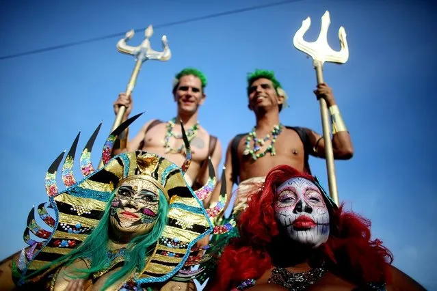 NEW YORK, NY - JUNE 22:  Revelers pose at the 2013 Mermaid Parade at Coney Island on June 22, 2013 in the Brooklyn borough of New York City. Coney Island was hard hit by Superstorm Sandy but parade organizers, whose offices were flooded, were able to raise $100,000 on Kickstarter to fund the parade. The Mermaid Parade began in 1983 and features participants dressed as mermaids and other sea creatures while paying homage to the former tradition of the Coney Island Mardi Gras, which ran annually in the early fall from 1903-1954.  (Photo by Mario Tama/Getty Images)