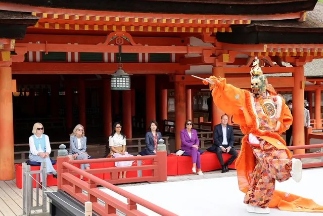 Spouses of leaders attending the G7 Summit Leaders' Meeting watch a performance during a visit to Itsukushima Shrine on Miyajima island, near Hiroshima, on the sidelines of the summit on May 20, 2023. (Photo by Japan Pool/AFP Photo)