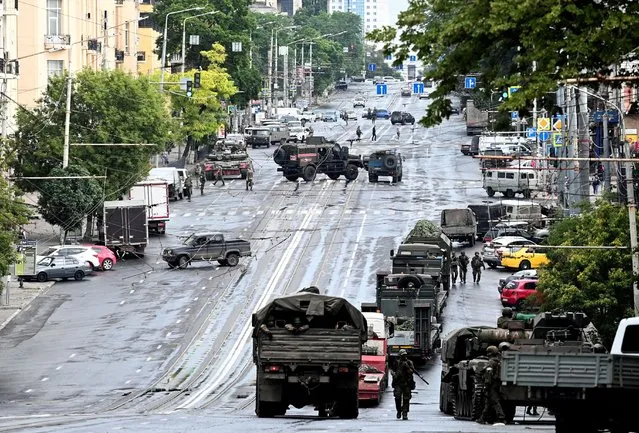 Fighters of Wagner private mercenary group are deployed in a street near the headquarters of the Southern Military District in the city of Rostov-on-Don, Russia on June 24, 2023. (Photo by Reuters/Stringer)
