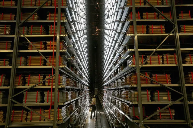 Resident engineer John Roberts poses as he looks at the millions of newspapers stored on racks at the National Newspaper Archive on January 23, 2015 in Boston Spa, United Kingdom. The British Librarys brand new National Newspaper Building officially opened today. The newly built storage void holds 60 million newspapers and periodicals spanning more than three centuries. (Photo by Christopher Furlong/Getty Images)