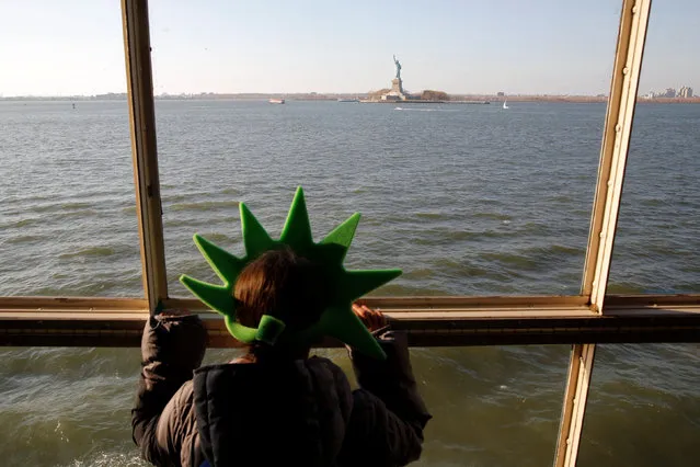 Avril Garcia of Mexico City rides the Staten Island Ferry in New York, U.S., November 17, 2016. (Photo by Andrew Kelly/Reuters)