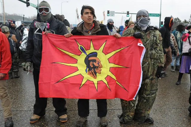 Protesters block Route 6 in Mandan on Thanksgiving day during a protest against plans to pass the Dakota Access pipeline near the Standing Rock Indian Reservation, North Dakota, U.S. November 24, 2016. (Photo by Stephanie Keith/Reuters)