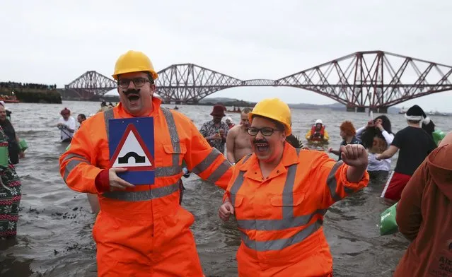 Swimmers in fancy dress participate in the New Year's Day Loony Dook swim at South Queensferry in Scotland, Britain January 1, 2016. (Photo by Russell Cheyne/Reuters)
