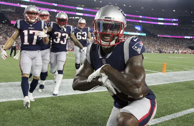 New England Patriots wide receiver Cordarrelle Patterson strikes a pose after scoring a touchdown against the Philadelphia Eagles during the second half of a preseason NFL football game, Thursday, August 16, 2018, in Foxborough, Mass. (Photo by Mary Schwalm/AP Photo)