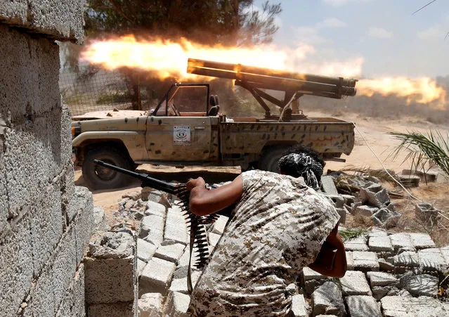 Libyan forces allied with the U.N.-backed government fire weapons during a battle with IS fighters in Sirte, Libya, July 21, 2016. (Photo by Goran Tomasevic/Reuters)