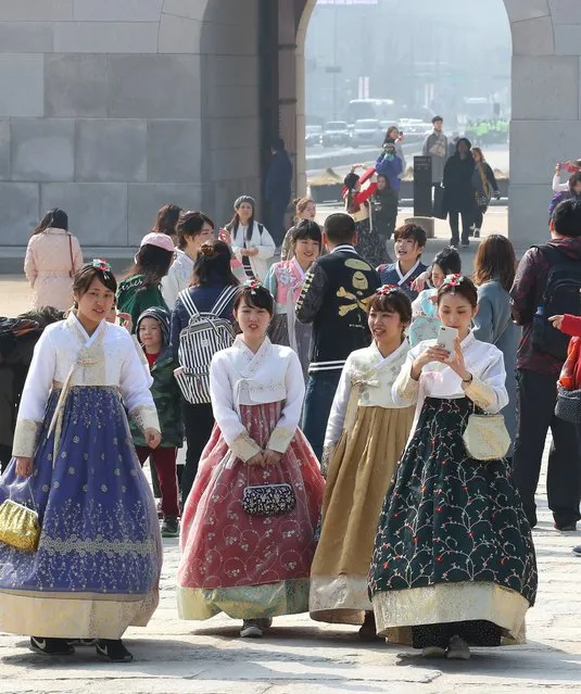 Tourists are in the traditional Korean costume, “hanbok”, at Gyeongbok Palace in downtown Seoul, South Korea, 11 March 2018. (Photo by EPA/EFE/Yonhap)