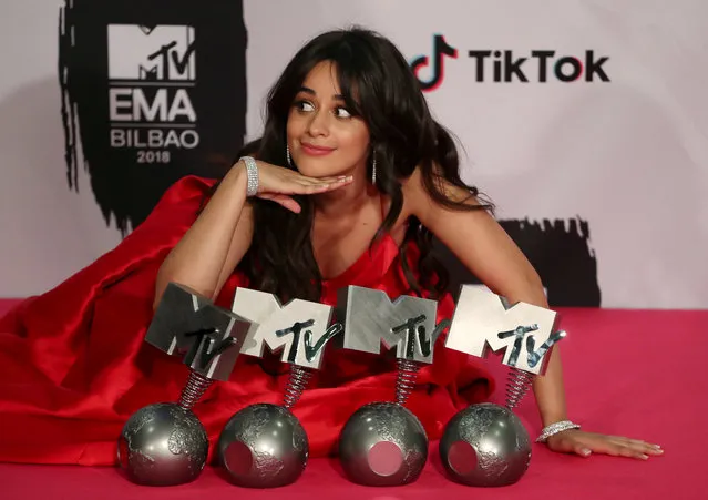 US- Cuban singer Camila Cabello poses with her four awards backstage during the MTV Europe Music Awards at the Bizkaia Arena in the northern Spanish city of Bilbao on November 4, 2018. (Photo by Sergio Perez/Reuters)
