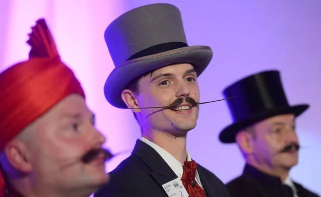 Juhana Helmenkalastaja competes in the “Moustache English” category of the World Beard Championships on November 2, 2013 in Leinfelden-Echterdingen, southern Germany. More than 200 competitors from over 20 countries take part in the event. (Photo by Franziska Kraufmann/AFP Photo/DPA)