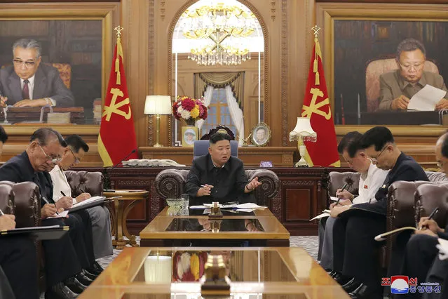 In this photo provided by the North Korean government, North Korean leader Kim Jong Un, center, attends a meeting with senior ruling party officials in Pyongyang, Monday, June 7, 2021. Independent journalists were not given access to cover the event depicted in this image distributed by the North Korean government. The content of this image is as provided and cannot be independently verified. (Photo by Korean Central News Agency/Korea News Service via AP Photo)